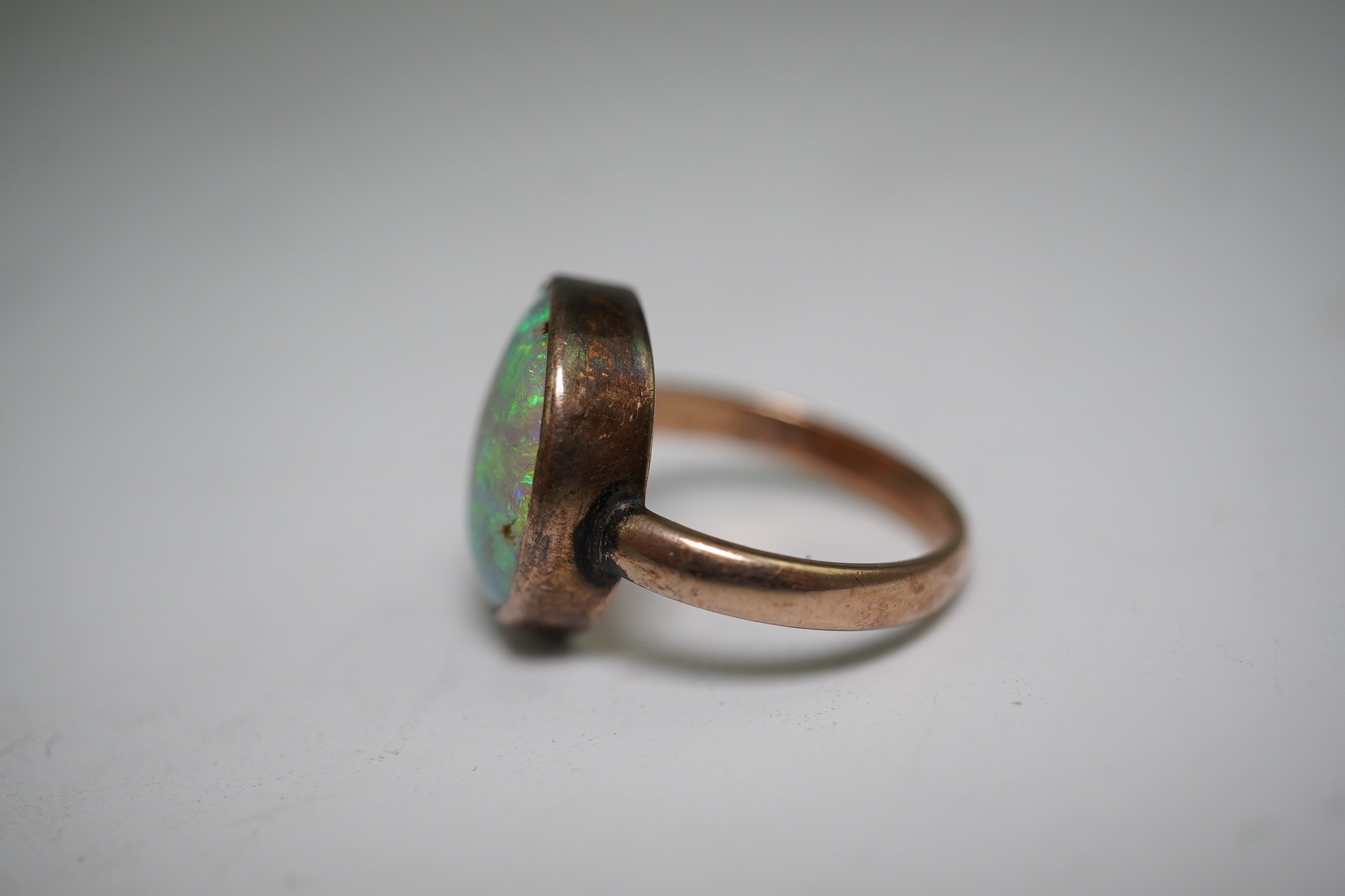 A 9ct gold opal dress ring, size J, gross weight 4.1 grams.